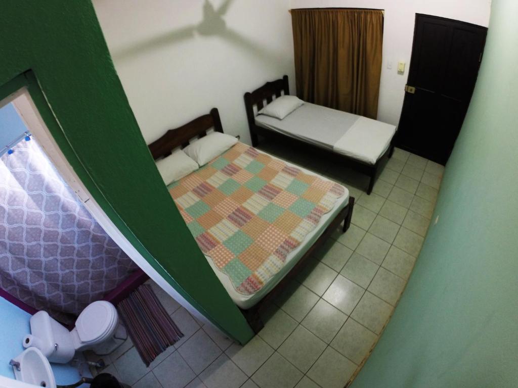 Postel nebo postele na pokoji v ubytování Tsunami Hostel