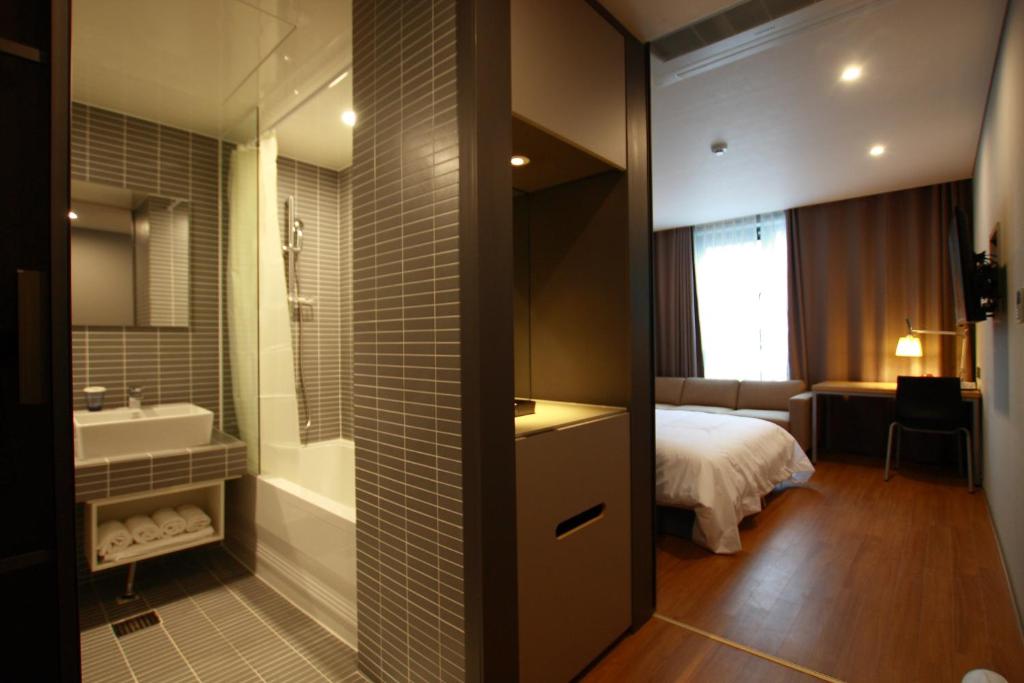 Postel nebo postele na pokoji v ubytování Mini Hotel 141