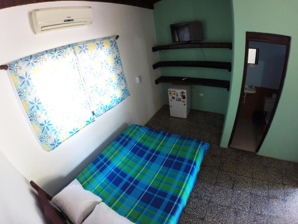 Postel nebo postele na pokoji v ubytování Tsunami Hostel
