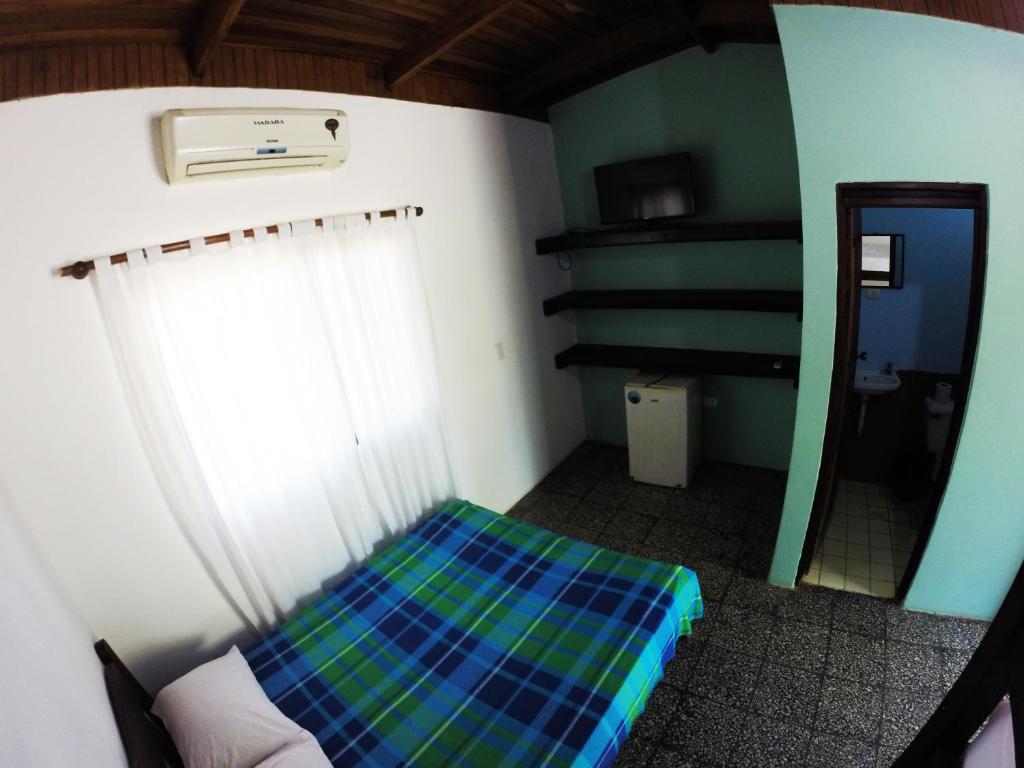 Postel nebo postele na pokoji v ubytování Tsunami Hostel