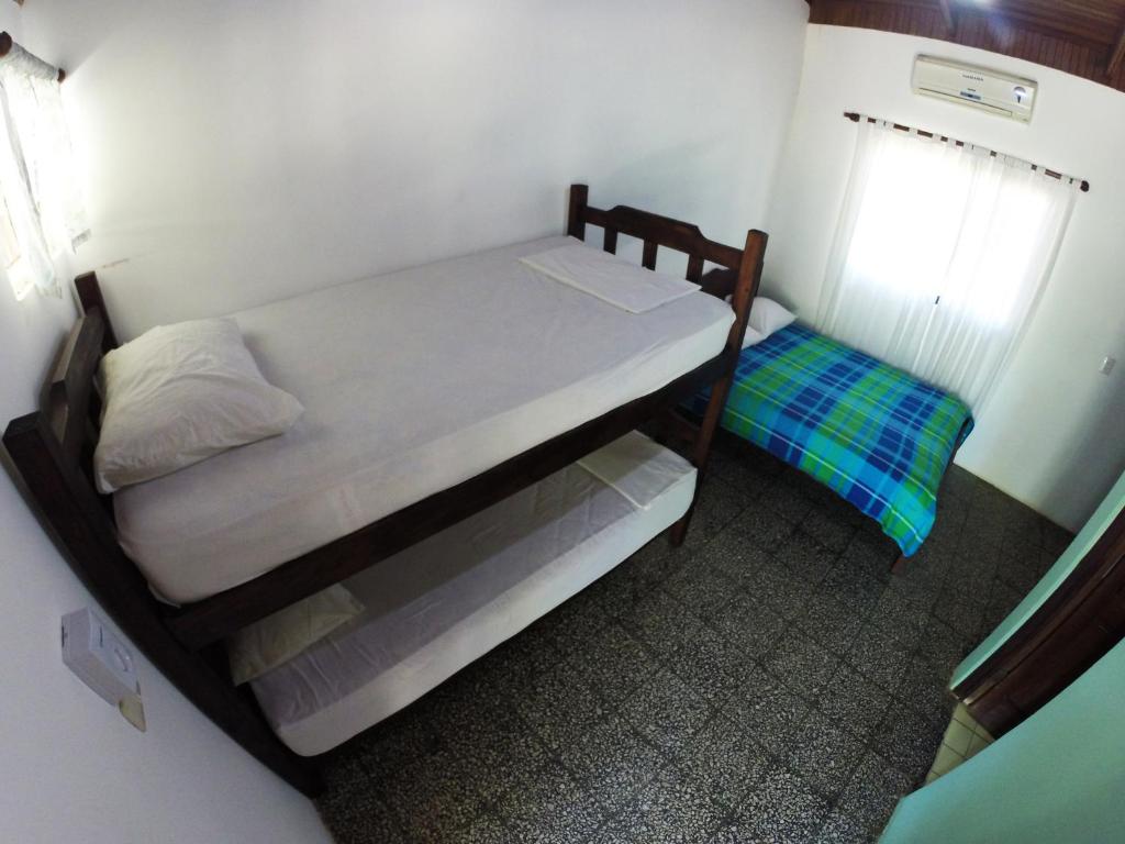 Postel nebo postele na pokoji v ubytování Tsunami Hostel