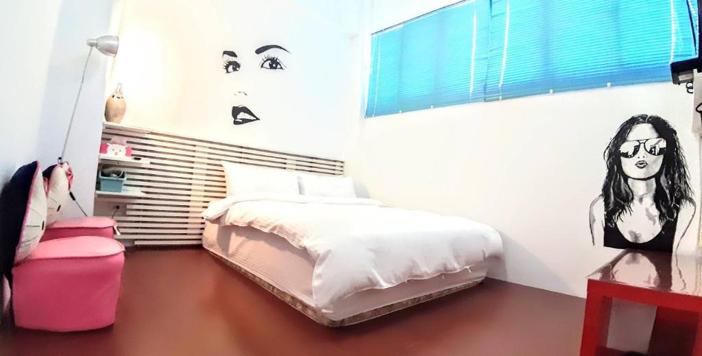 Postel nebo postele na pokoji v ubytování Wushih Surf Hostel