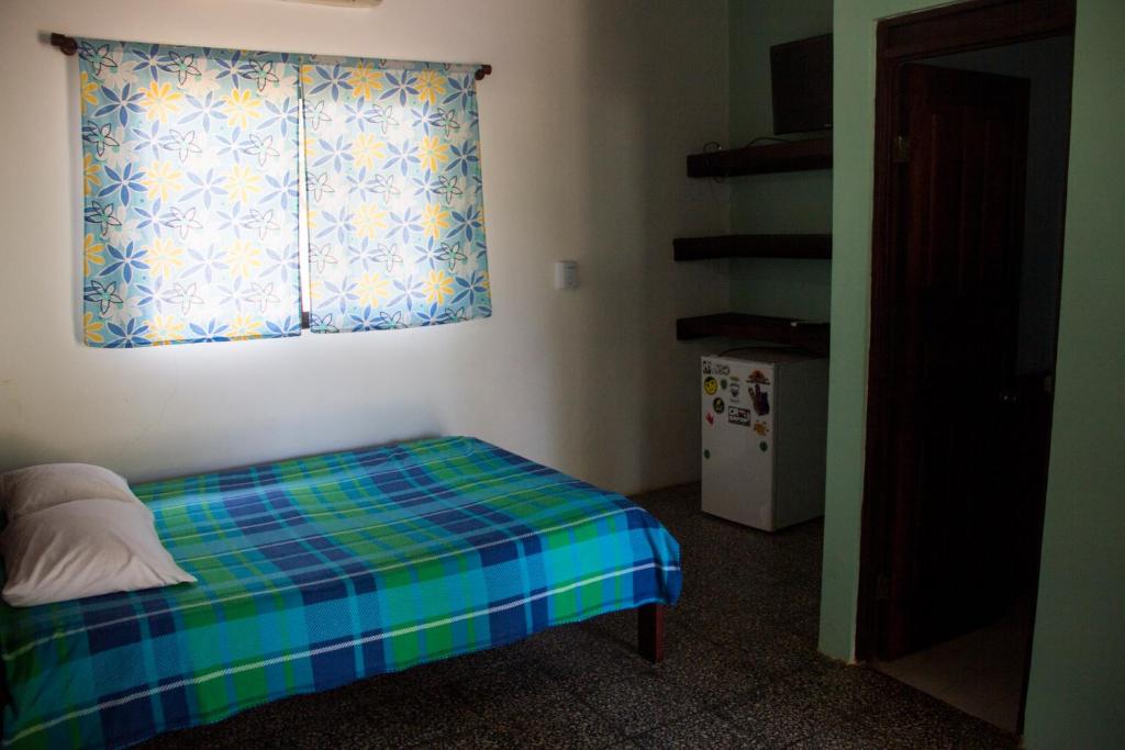 Postel nebo postele na pokoji v ubytování Tsunami Hostel