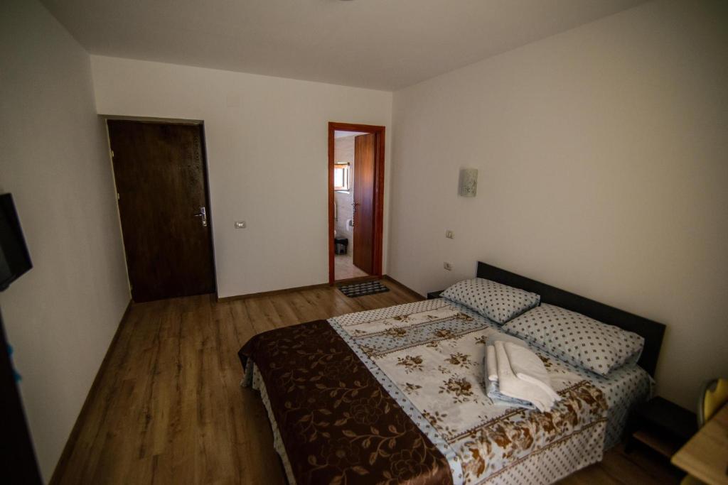 Postel nebo postele na pokoji v ubytování Vila Onasis