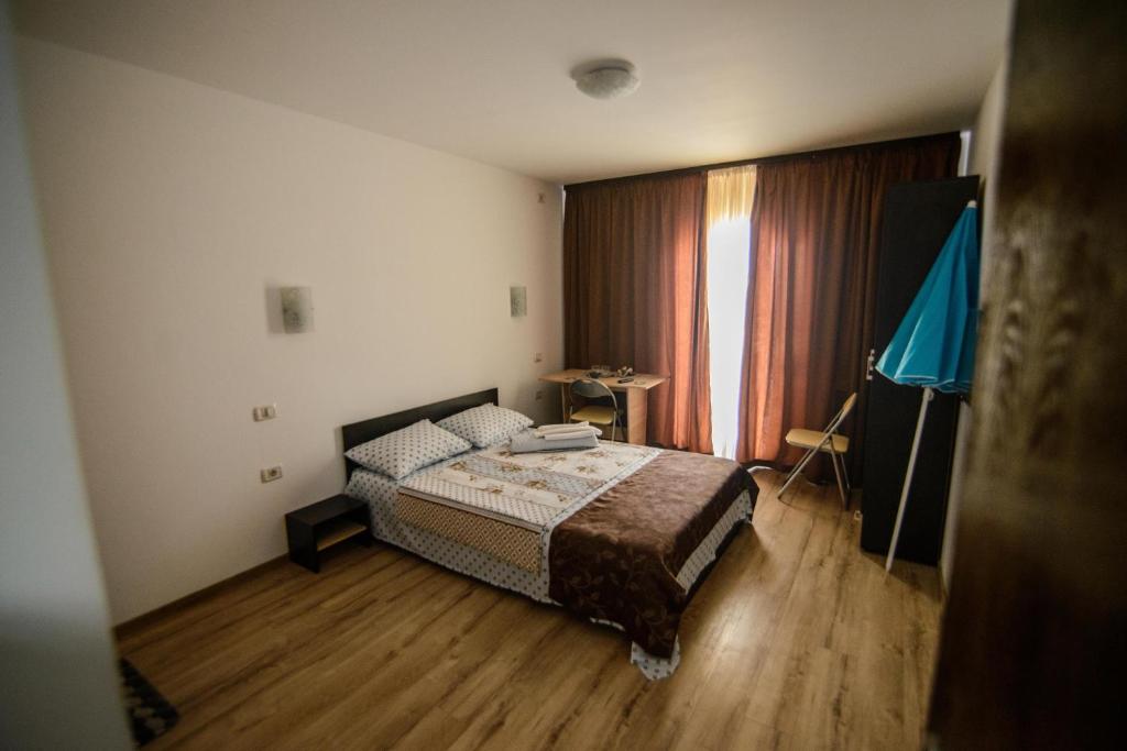 Postel nebo postele na pokoji v ubytování Vila Onasis