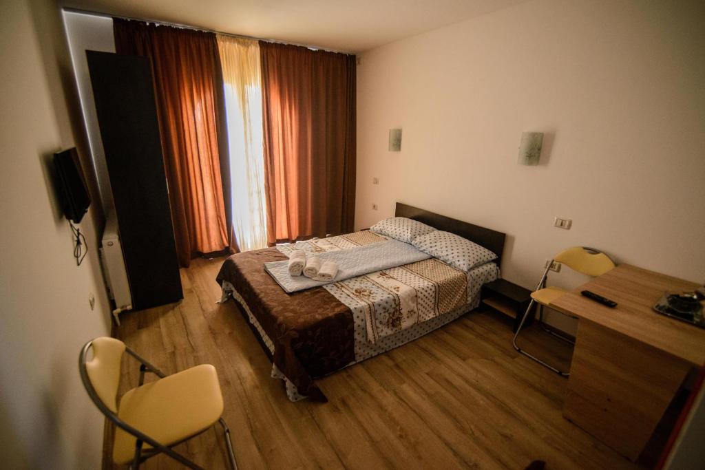 Postel nebo postele na pokoji v ubytování Vila Onasis
