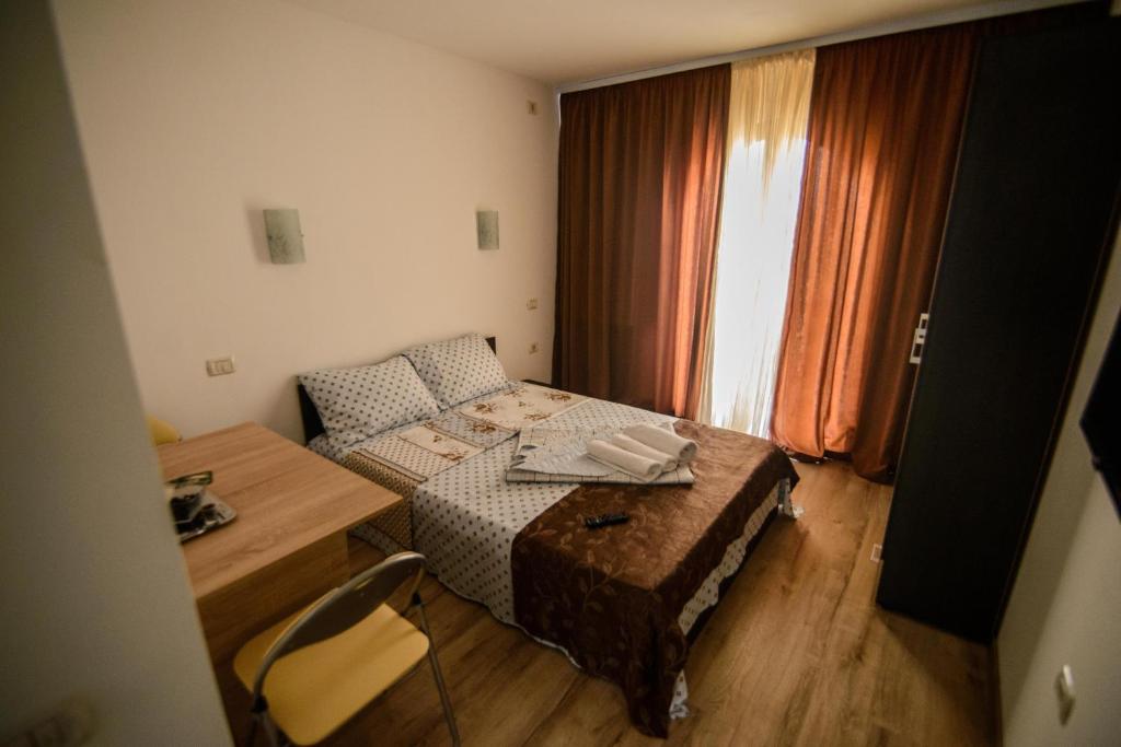 Postel nebo postele na pokoji v ubytování Vila Onasis