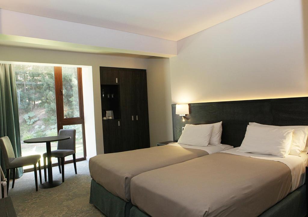 Postel nebo postele na pokoji v ubytování Hotel Bosque de Reñaca
