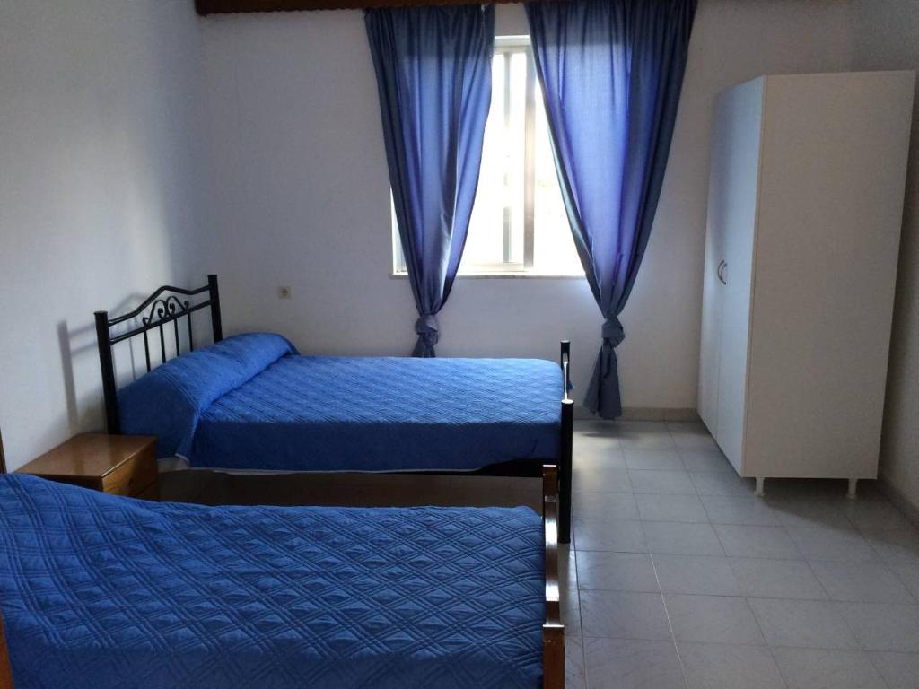 A bed or beds in a room at House with Sea View close to Platanias