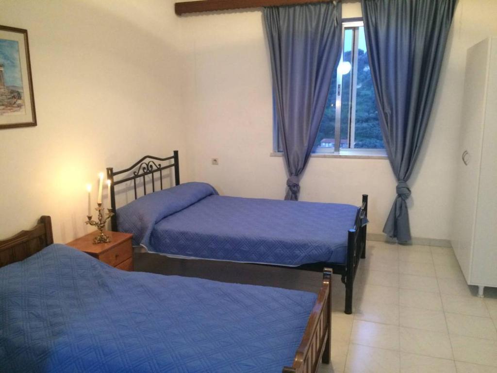 A bed or beds in a room at House with Sea View close to Platanias