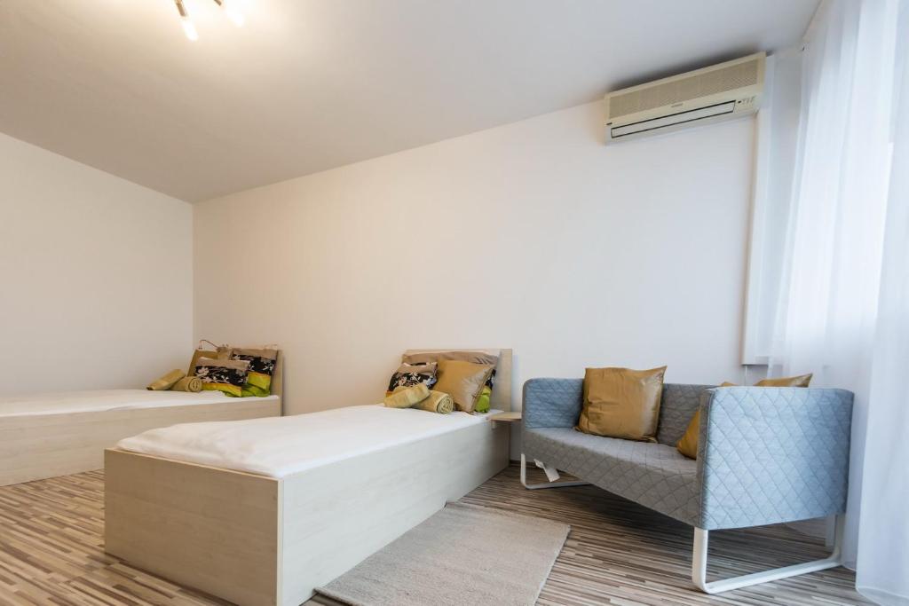 Posteľ alebo postele v izbe v ubytovaní Central Home- Pesterzsébet