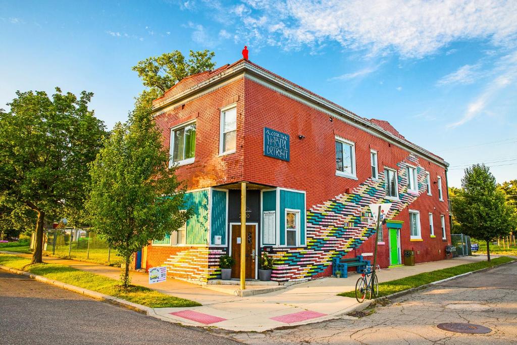 a brick building with a staircase on the side of it at Hostel Detroit in Detroit