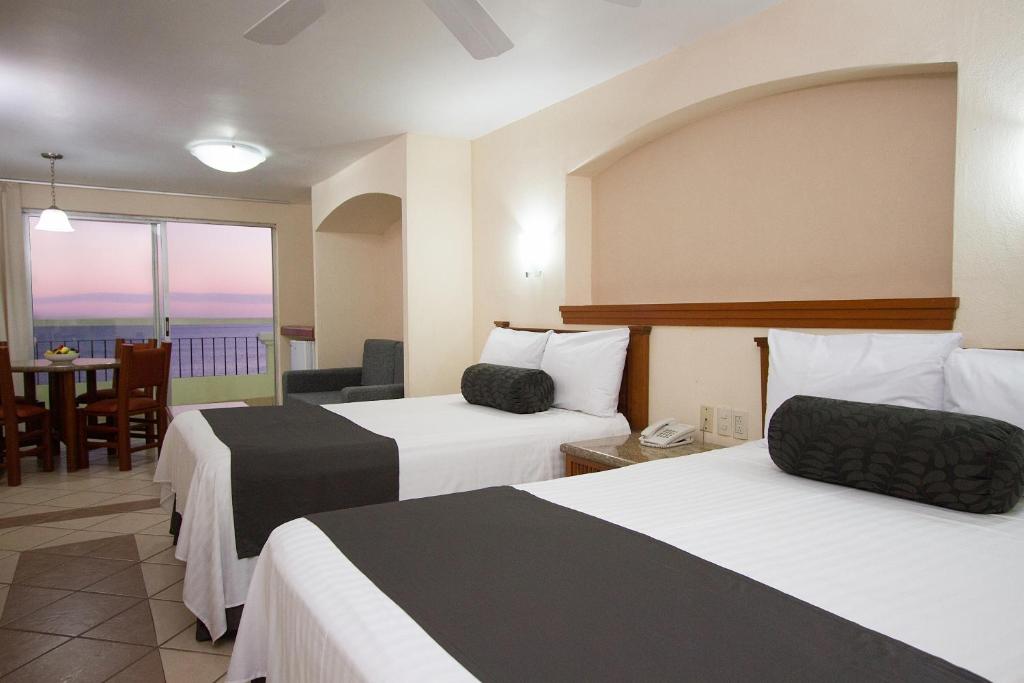 Cama o camas de una habitación en Don Pelayo Pacific Beach