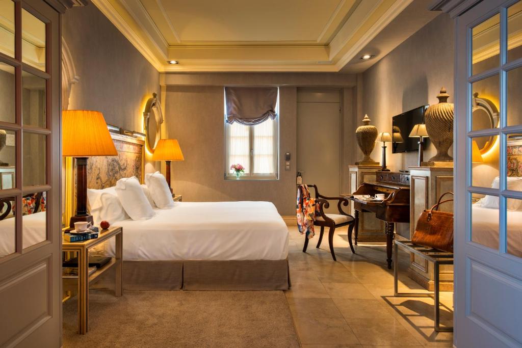 Postel nebo postele na pokoji v ubytování Hotel Casa Del Poeta