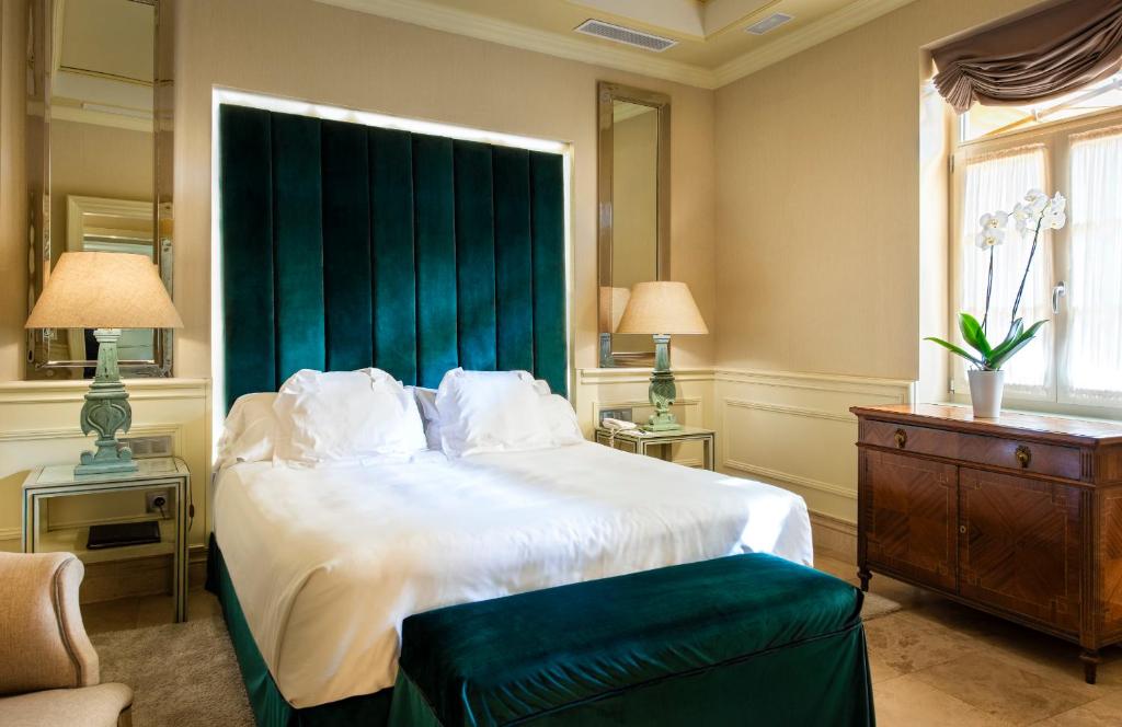 Postel nebo postele na pokoji v ubytování Hotel Casa Del Poeta