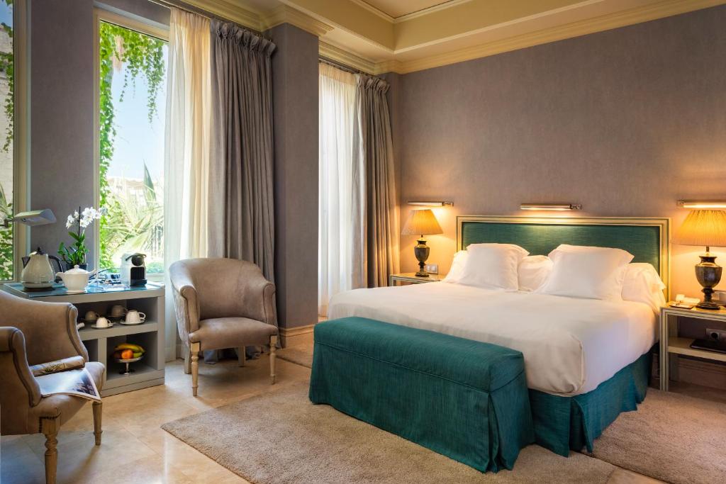 Postel nebo postele na pokoji v ubytování Hotel Casa Del Poeta