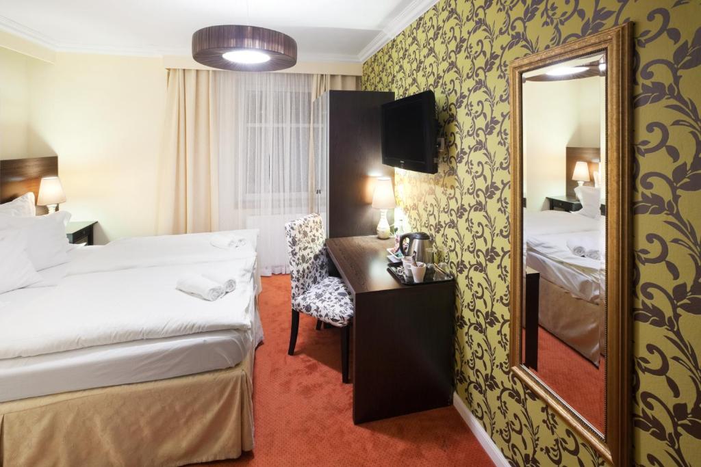 Posteľ alebo postele v izbe v ubytovaní Pytloun Design Self Check-in Hotel