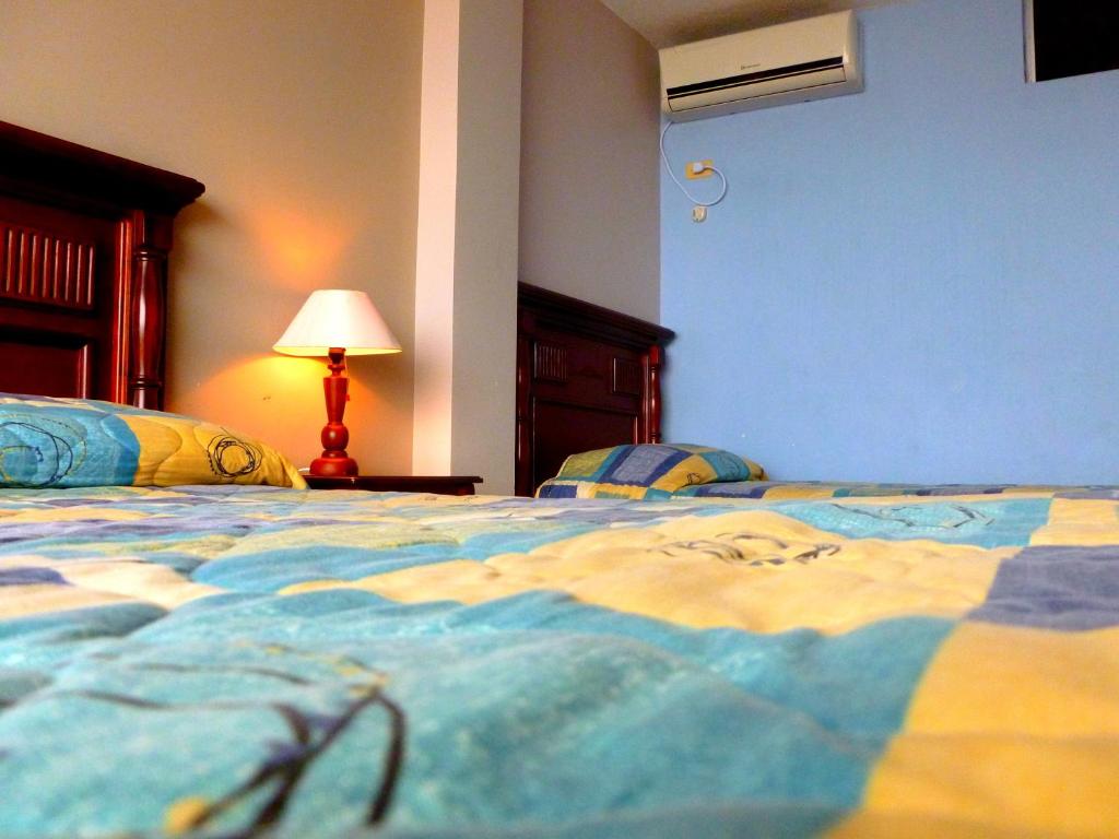 Postel nebo postele na pokoji v ubytování Costa Paraiso