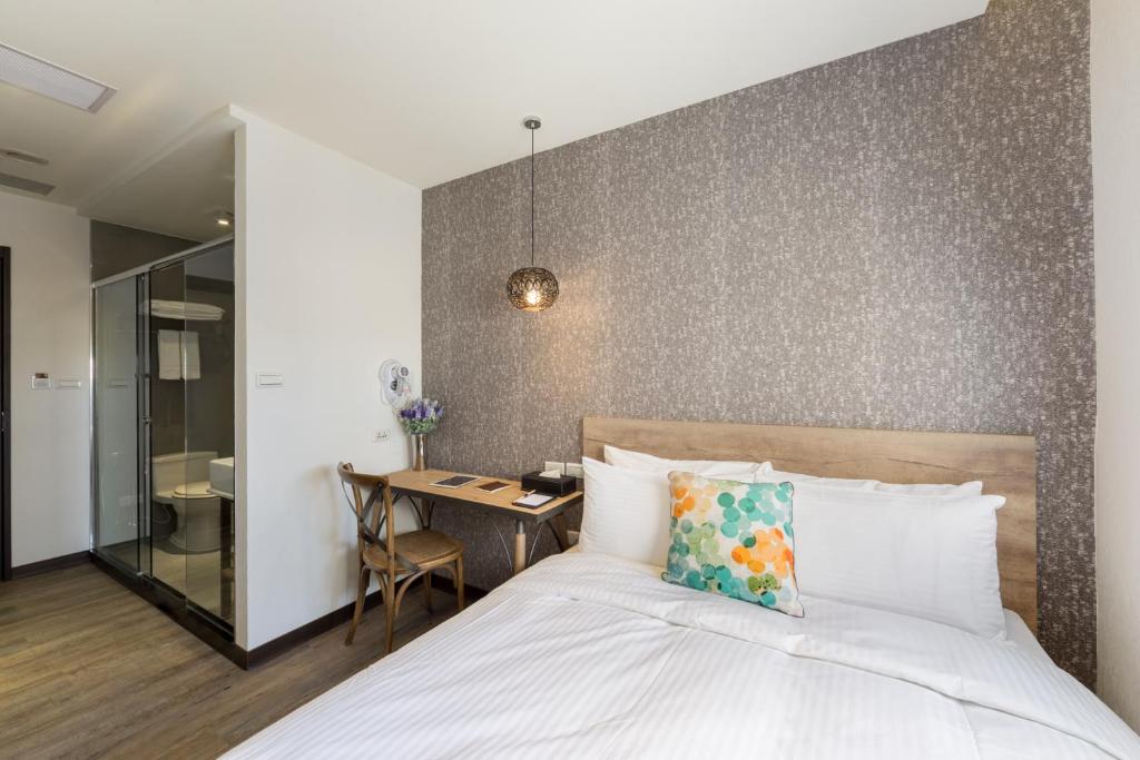 Postel nebo postele na pokoji v ubytování Herb Art Hotel