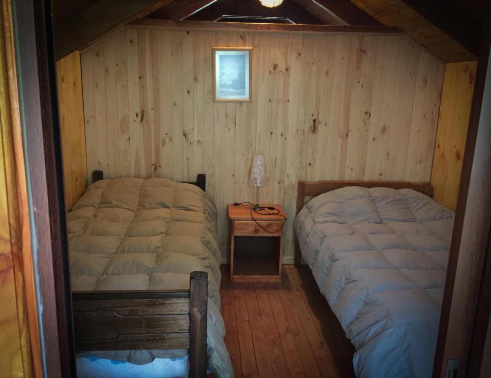 Letto o letti in una camera di Llaima Camp