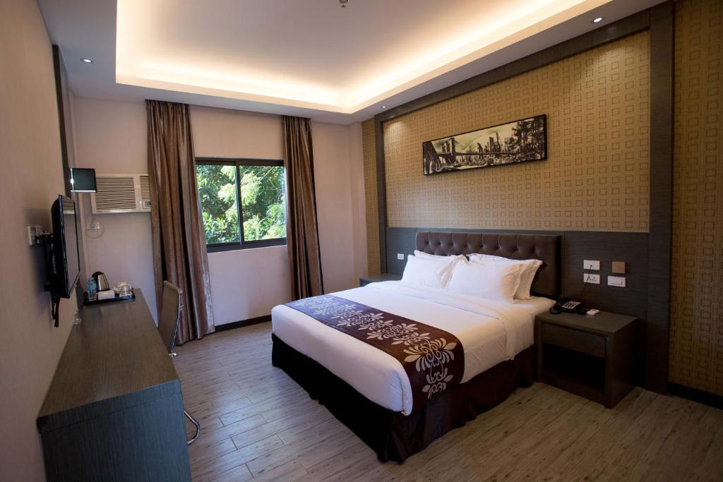Tempat tidur dalam kamar di Vienna Hotel