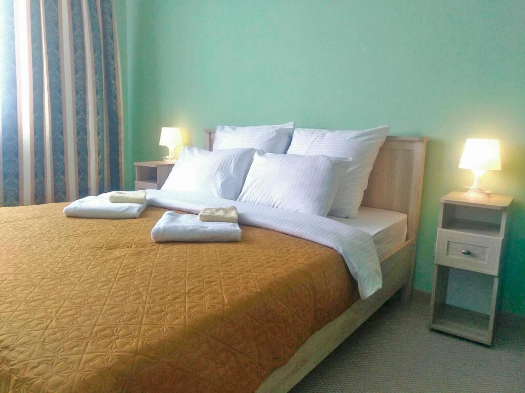 Кровать или кровати в номере Отель Большой Урал на Стачек