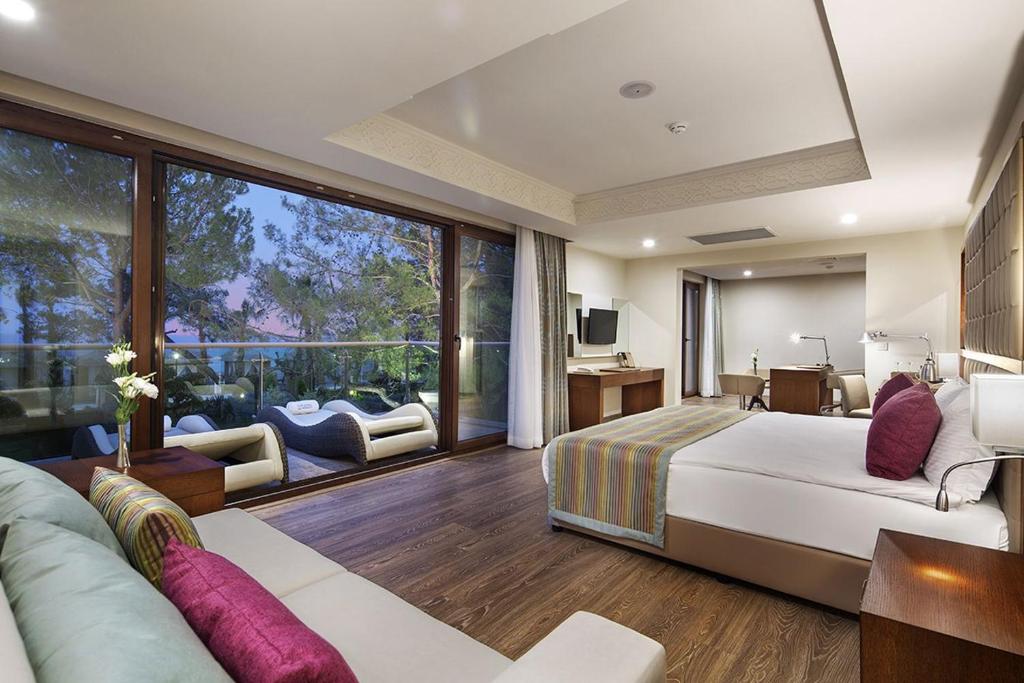 Postel nebo postele na pokoji v ubytování Nirvana Mediterranean Excellence - Ultra All Inclusive