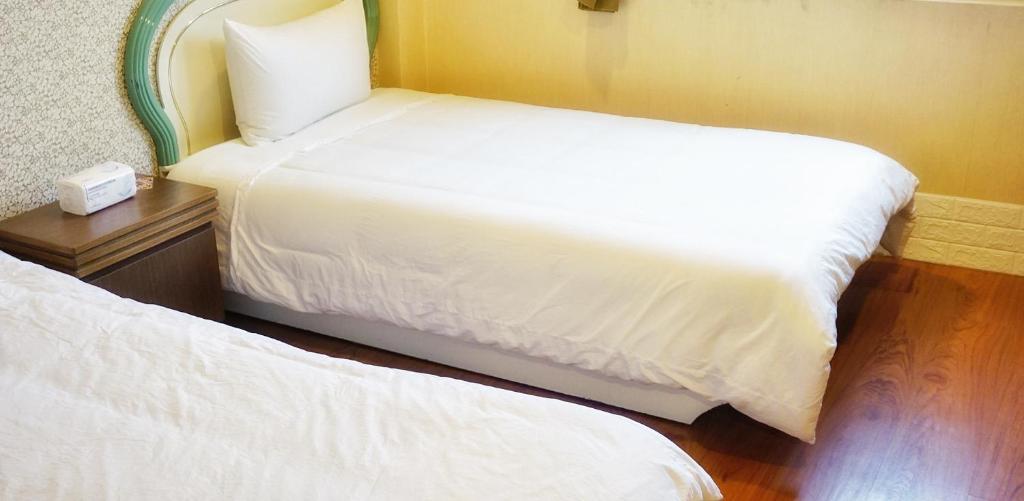 Llit o llits en una habitació de Red Roof B&B