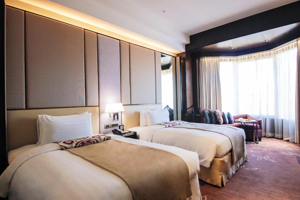 Postel nebo postele na pokoji v ubytování Diamond Hotel Philippines