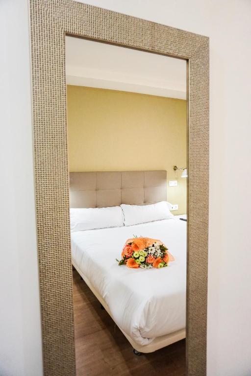 Postel nebo postele na pokoji v ubytování Hotel Lidar