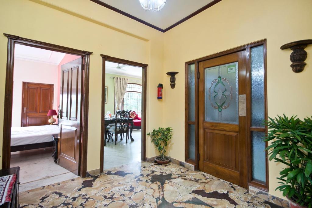 Postel nebo postele na pokoji v ubytování Prakash Kutir B&B