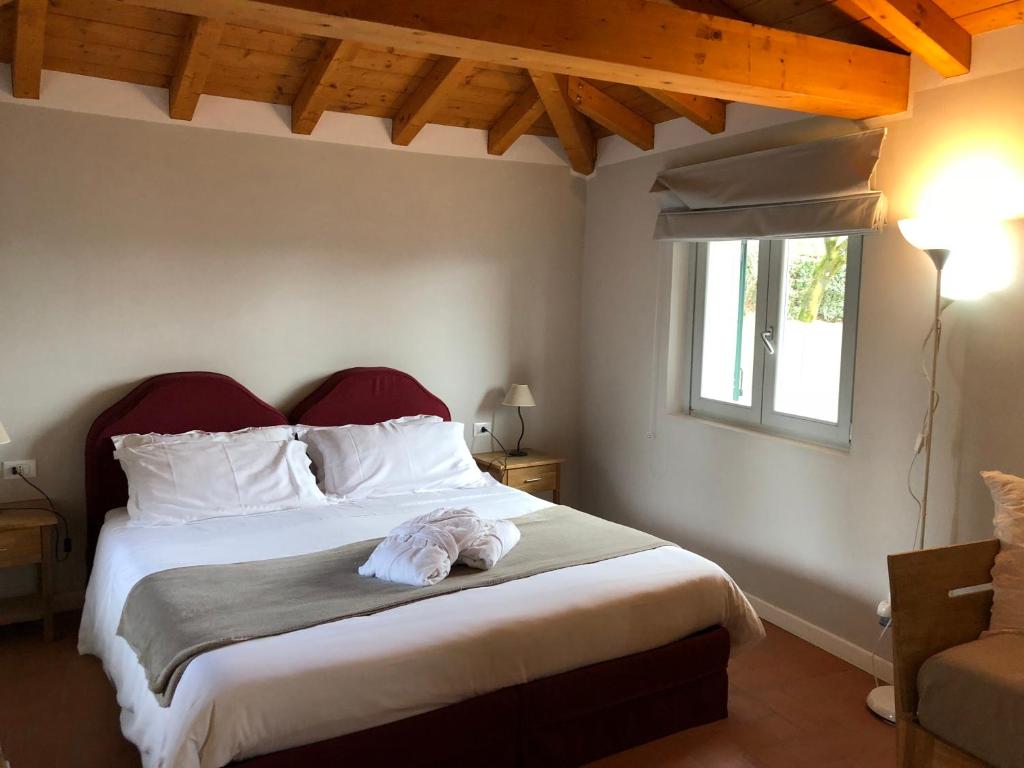 Postel nebo postele na pokoji v ubytování Locanda Pozzetto