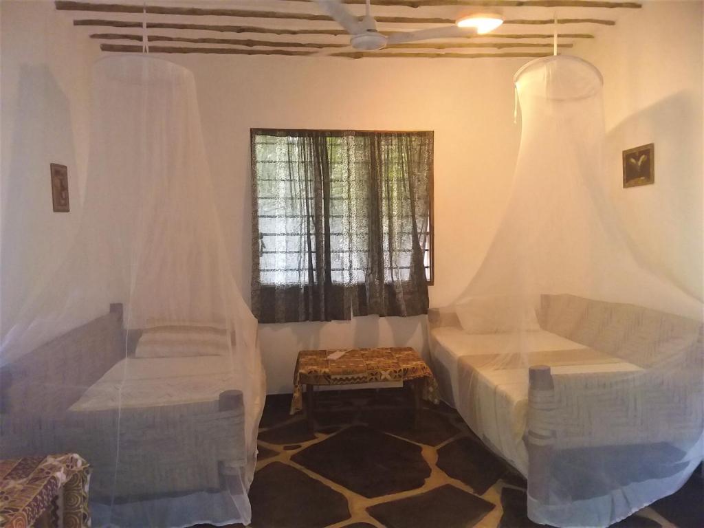 Posezení v ubytování Sheba Cottages - Diani Beach