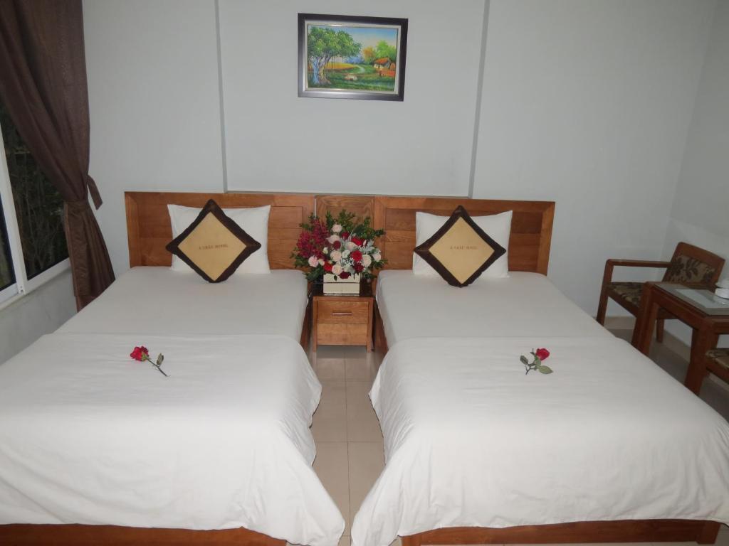 Postel nebo postele na pokoji v ubytování Green Hotel