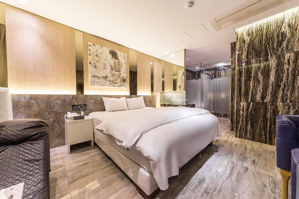 Postel nebo postele na pokoji v ubytování Guwol Hotel