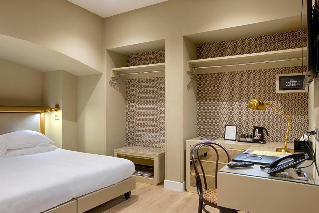 Łóżko lub łóżka w pokoju w obiekcie Caruso Place Boutique & Wellness Suites