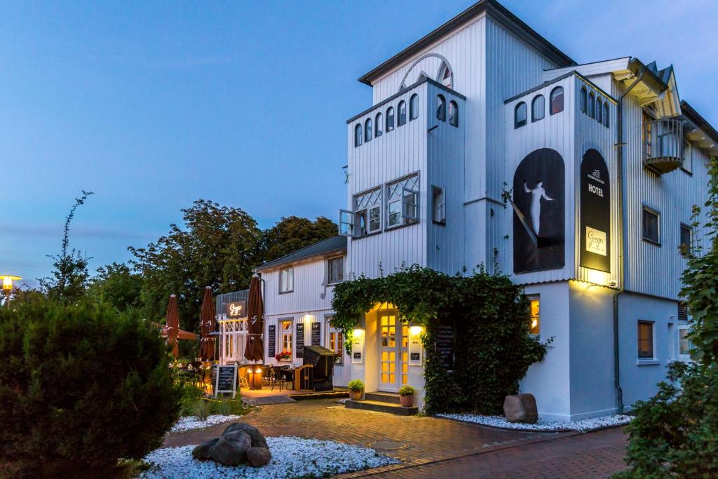 a large white building with a cross on it at Elisabeth von Eicken in Ahrenshoop