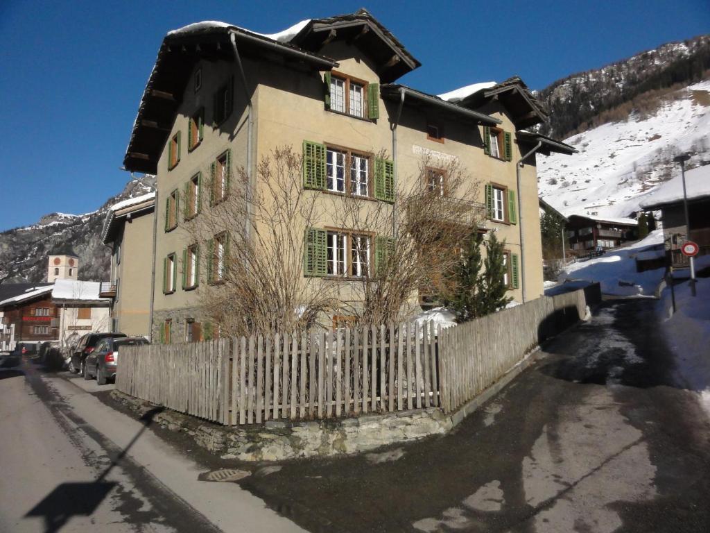 a building with a fence in front of it at Apartment Walter in Vals