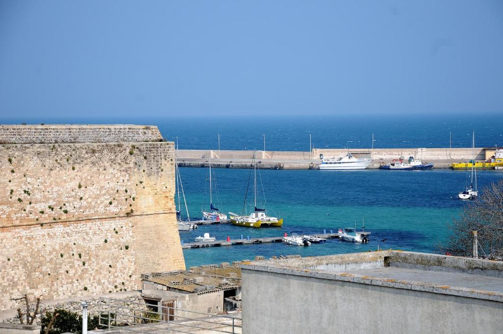 a view of a harbor with boats in the water at Appartamenti porta mare in Otranto