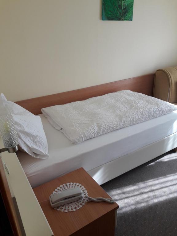Postel nebo postele na pokoji v ubytování Hotel Lux