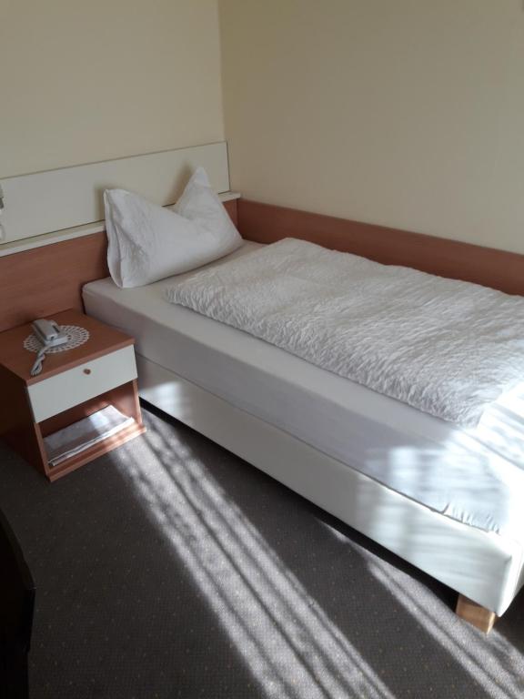 Postel nebo postele na pokoji v ubytování Hotel Lux