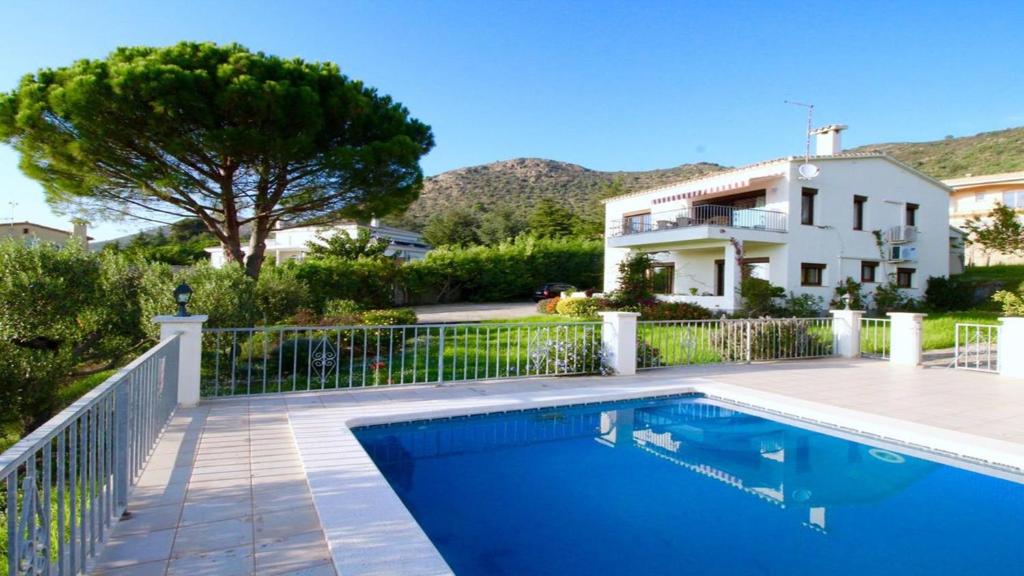a swimming pool in front of a house at Global Immo 8005 Casa Muga in Pau