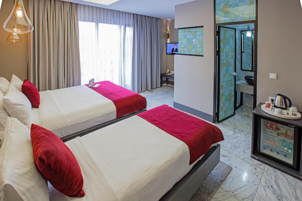 Postel nebo postele na pokoji v ubytování Nowy Efendi Hotel - Special Category