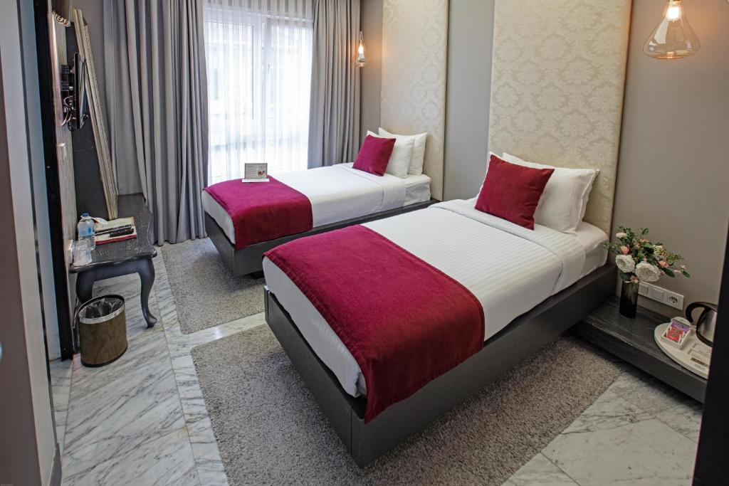 Postel nebo postele na pokoji v ubytování Nowy Efendi Hotel - Special Category