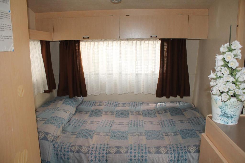 Postel nebo postele na pokoji v ubytování Camping Parco Capraro
