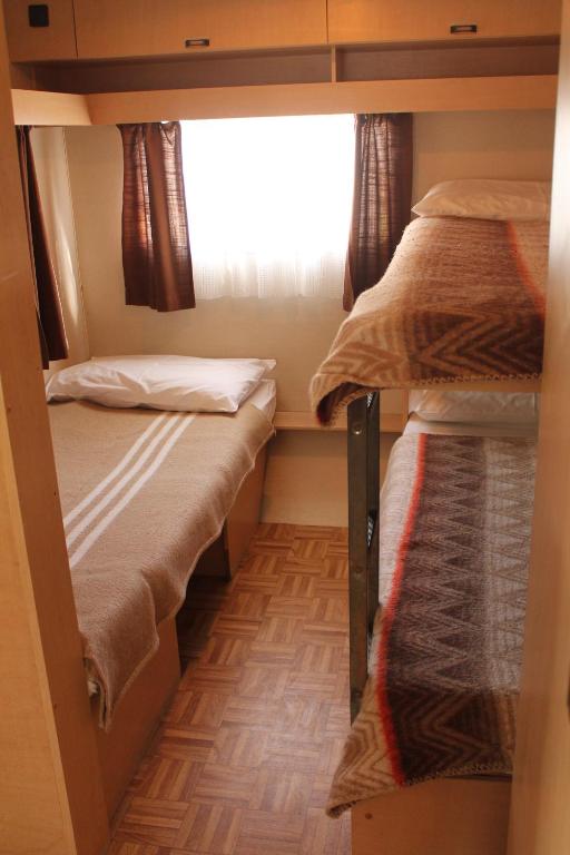Postel nebo postele na pokoji v ubytování Camping Parco Capraro