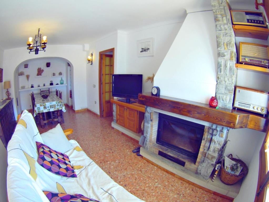Televízia a/alebo spoločenská miestnosť v ubytovaní VACAY Apartamento Montgo, agradable jardin! en Costa Brava l'Escala!