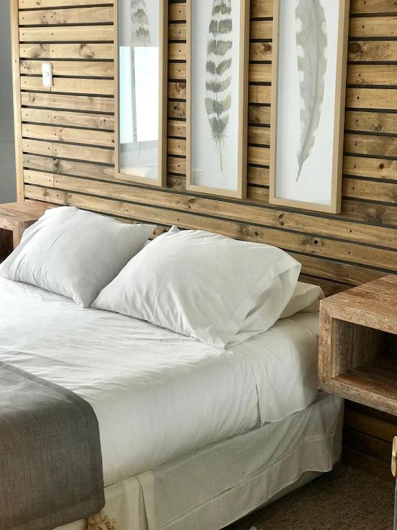 Postel nebo postele na pokoji v ubytování Etnico Bío Bío Hotel