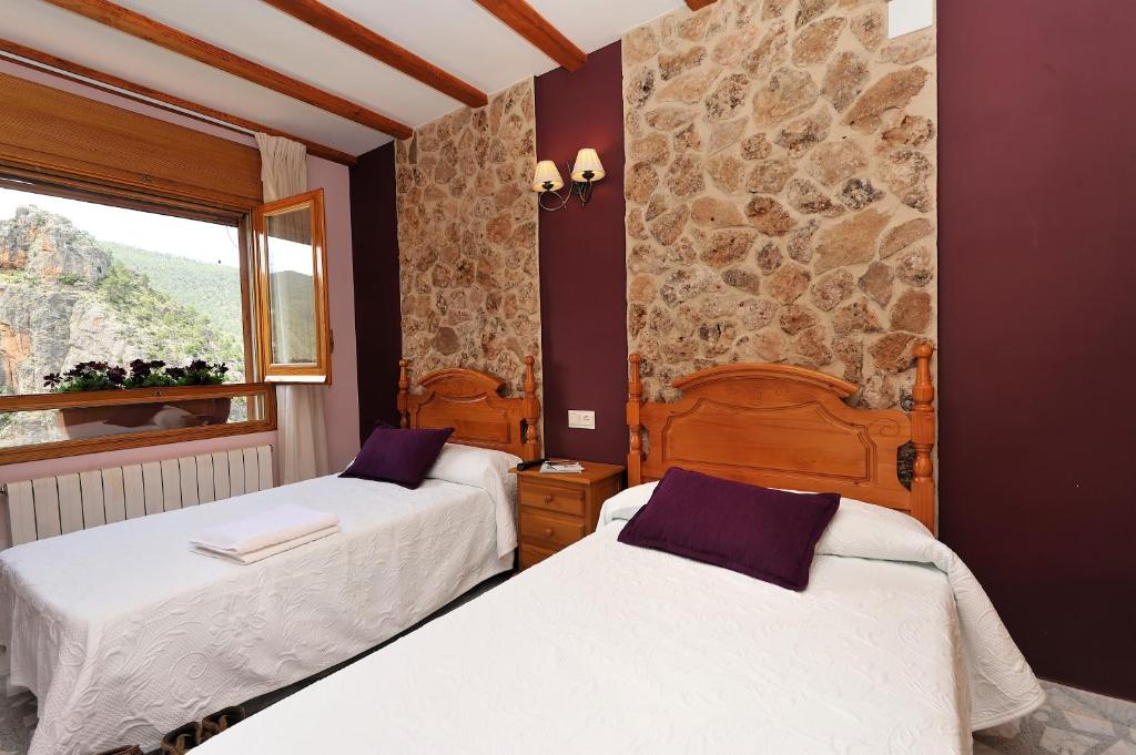 Postel nebo postele na pokoji v ubytování Miralmundo Alojamientos Rurales Ayna - HOSTAL RURAL
