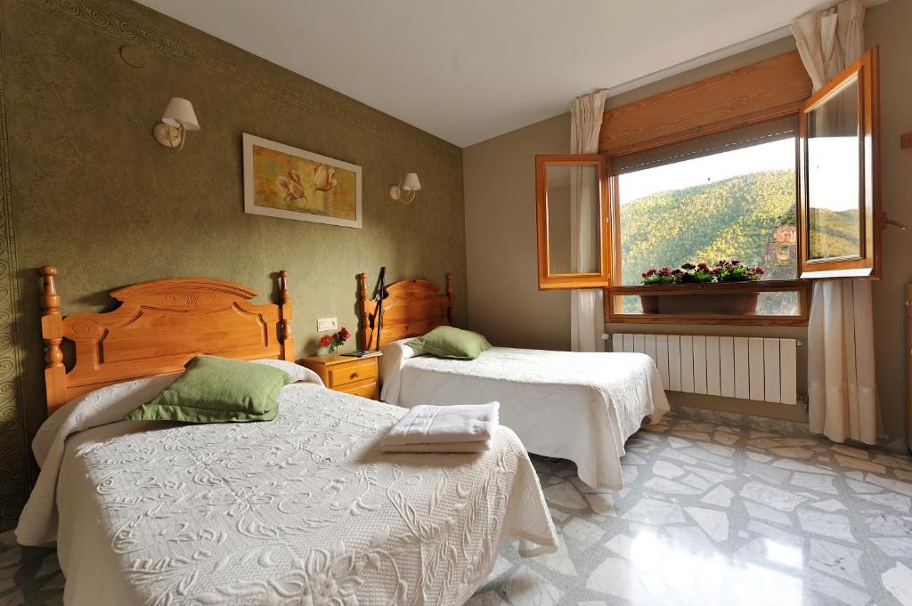 Postel nebo postele na pokoji v ubytování Miralmundo Alojamientos Rurales Ayna - HOSTAL RURAL